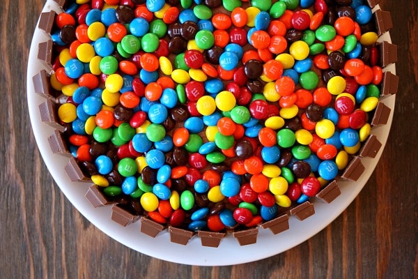 I love how the sea of MM's makes this cake look so pretty I love how the sea of MM's makes this cake look so pretty