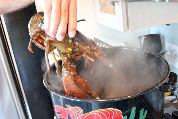 How long does it take to cook lobster per pound by steaming or boiling it?