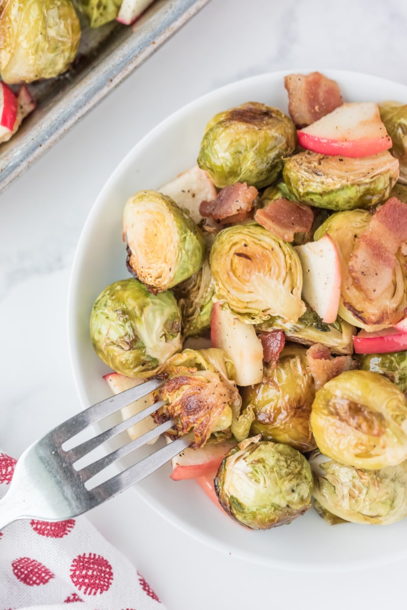 fork grabbing brussels sprouts in dish