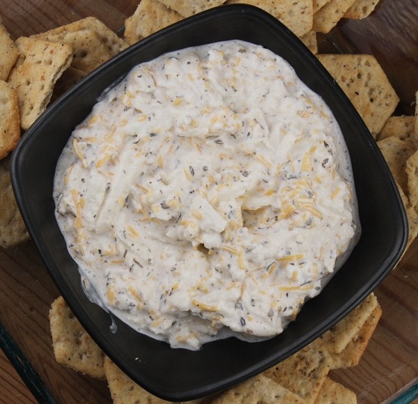 bowl of apple cheese spread surrounded by crackers