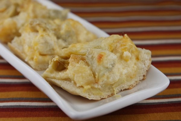 Cheese and Artichoke Bread Bites Cheese and Artichoke Bread Bites on a white platter