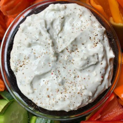 overhead shot of blue cheese dip surrounded by fresh cut vegetables