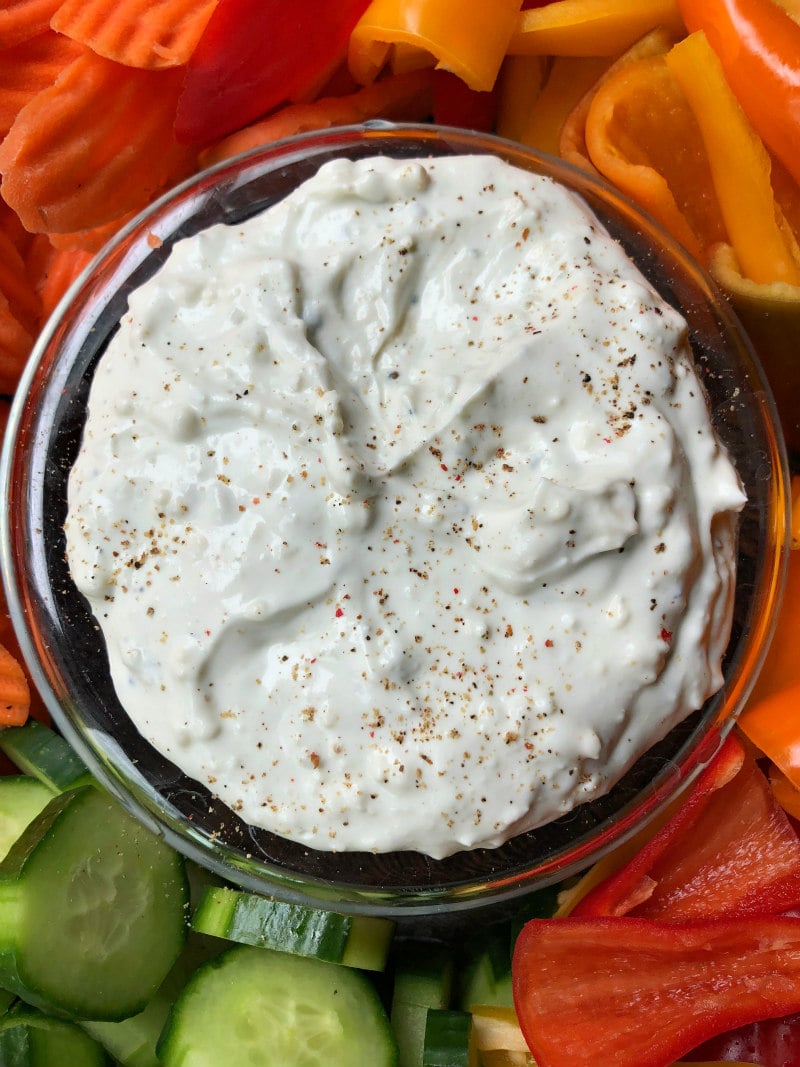 overhead shot of blue cheese dip surrounded by fresh cut vegetables