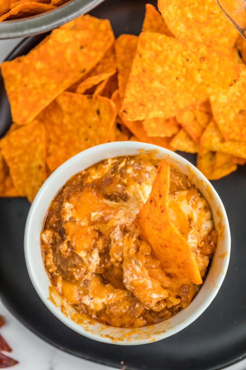 chili cheese dip in a bowl with chips