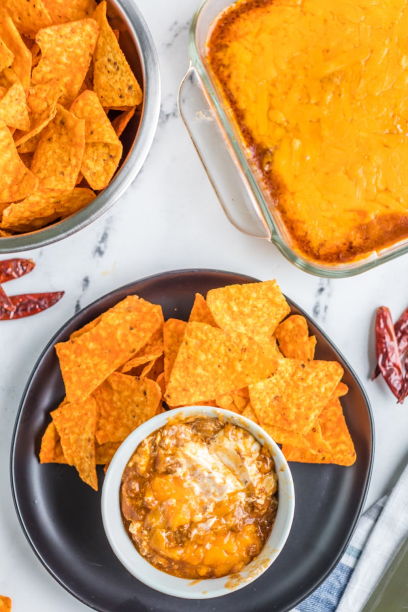 plate of chips and chili cheese dip