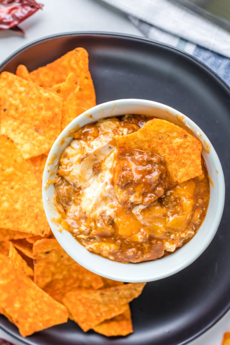 white bowl with chili cheese dip and chips
