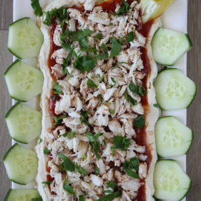 overhead shot of crab spread surrounded by sliced cucumber