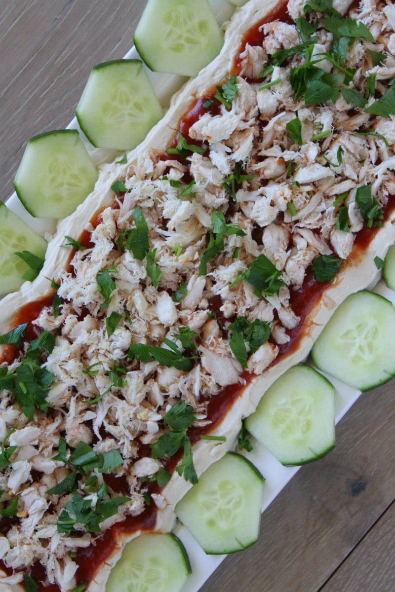 Overhead shot of Crab Spread appetizer served with cucumbers