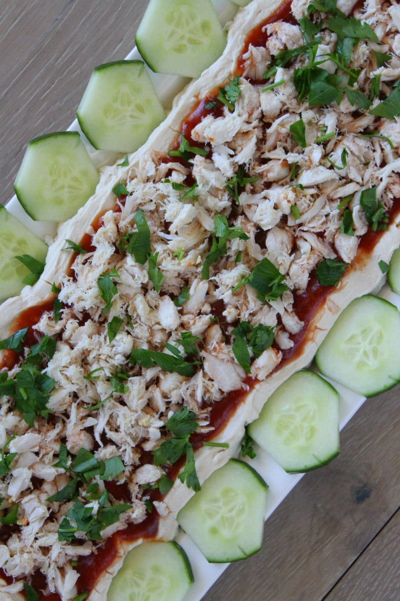 Crab spread appetizer recipe from RecipeGirl.com #crab #spread #appetizer #dip #party #entertaining #recipe #RecipeGirl Overhead shot of Crab Spread appetizer served with cucumbers