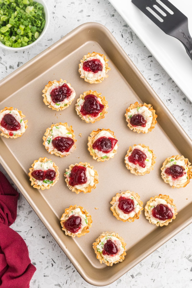cranberry crab phyllo cups on a baking sheet