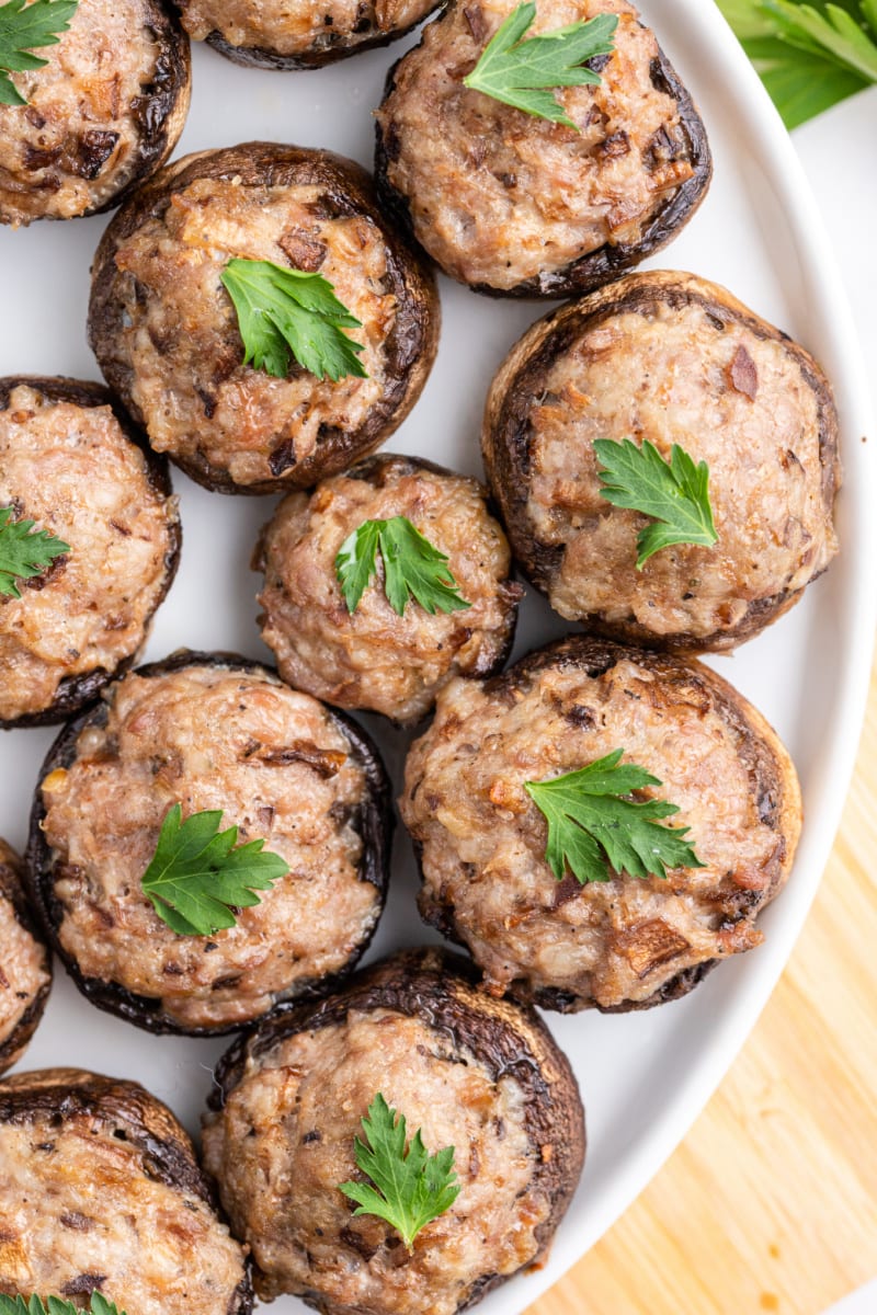 stuffed mushrooms on a white platter