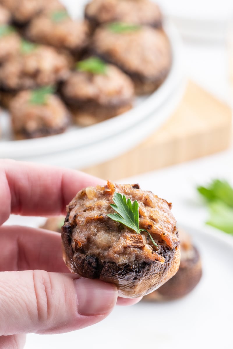 hand holding a stuffed mushroom