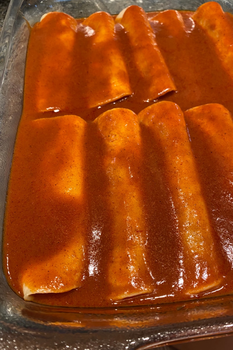 enchiladas with sauce on top