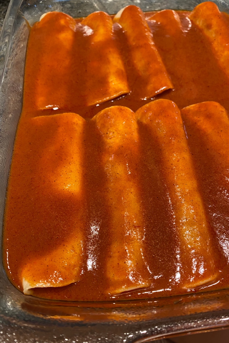 Best Enchilada Sauce recipe from RecipeGirl.com #best #enchilada #sauce #recipe #RecipeGirl #homemade enchiladas with sauce on top