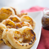 fig and gruyere palmiers on a white plate