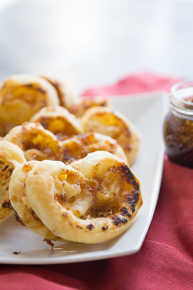 fig and gruyere palmiers on a white plate