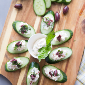 greek salad bites displayed on board