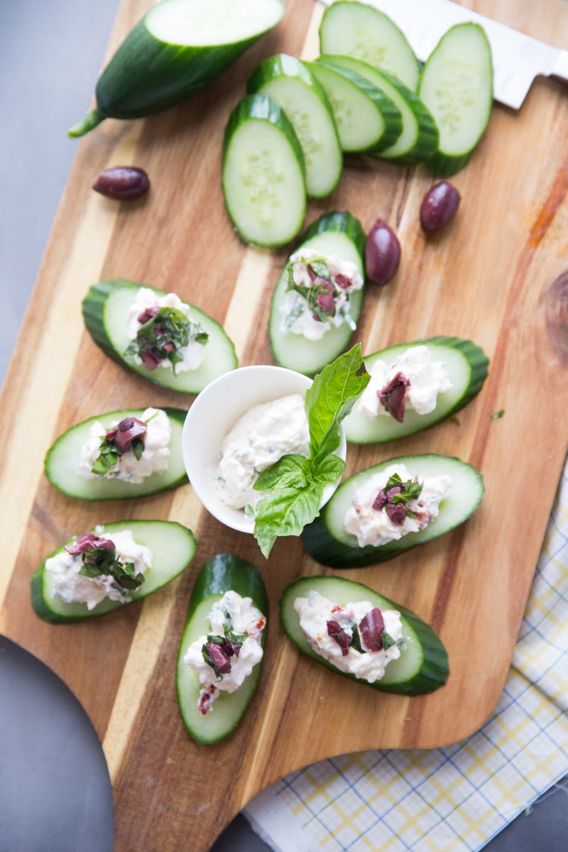 Greek Salad Bites recipe from RecipeGirl.com #greek #salad #bites #appetizer #recipe #RecipeGirl greek salad bites displayed on board