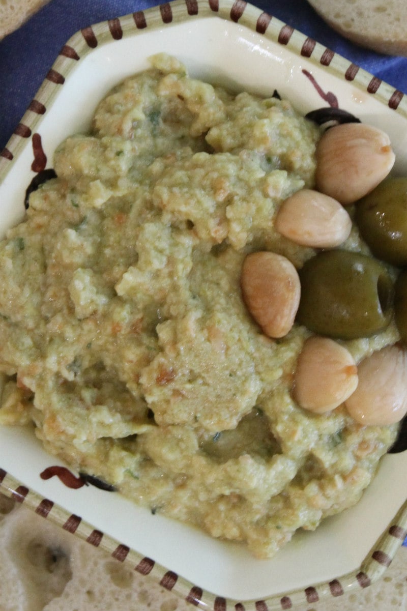 Green Olive and Almond Spread recipe from RecipeGirl.com #green #olive #greenolives #olives #almond #almonds #appetizer #spread #dip #recipe #RecipeGirl dish filled with green olive spread