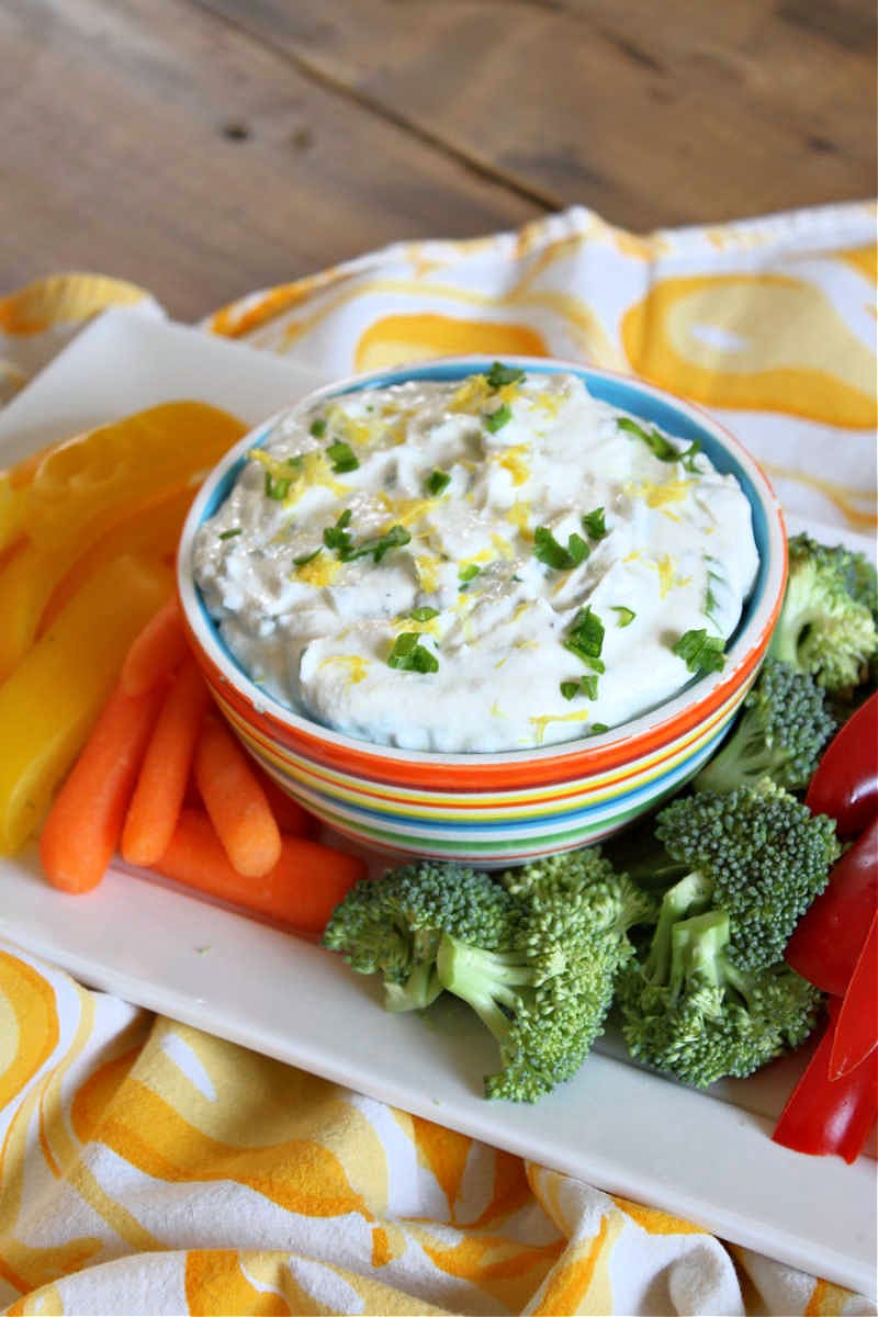 lemon chive cheese dip in bowl with veggies