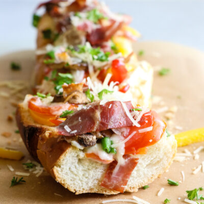 loaded bruschetta on a wood board