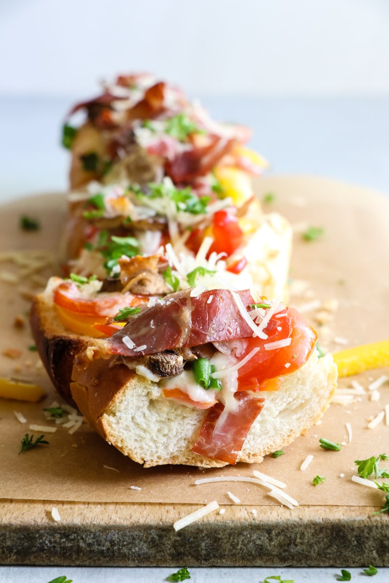 loaded bruschetta on a wood board