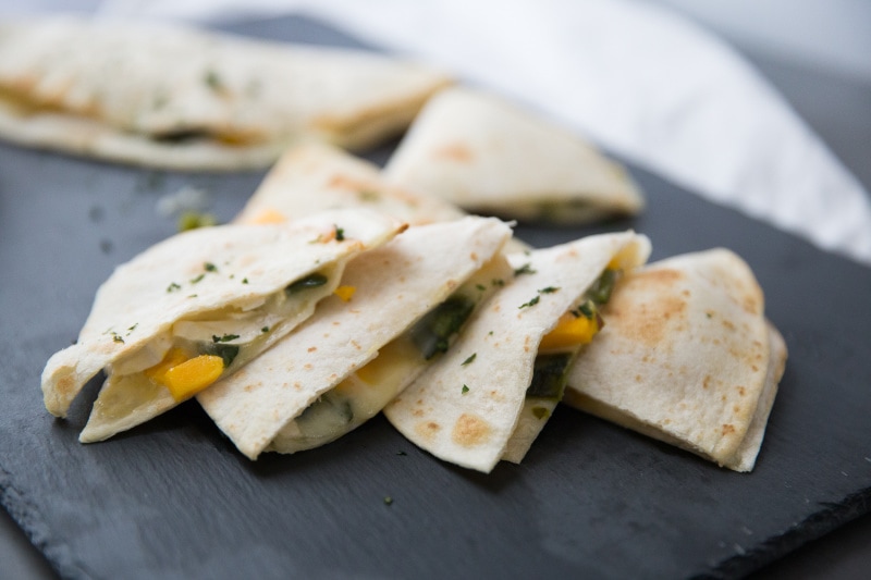 mango chili quesadilla cut into wedges