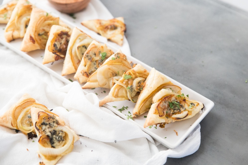 pastry triangle appetizers on a white platter