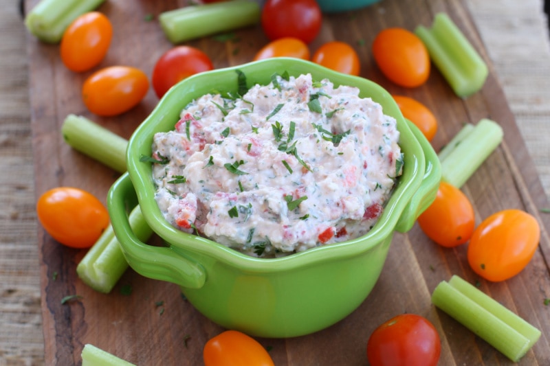dip in a green dish with veggies