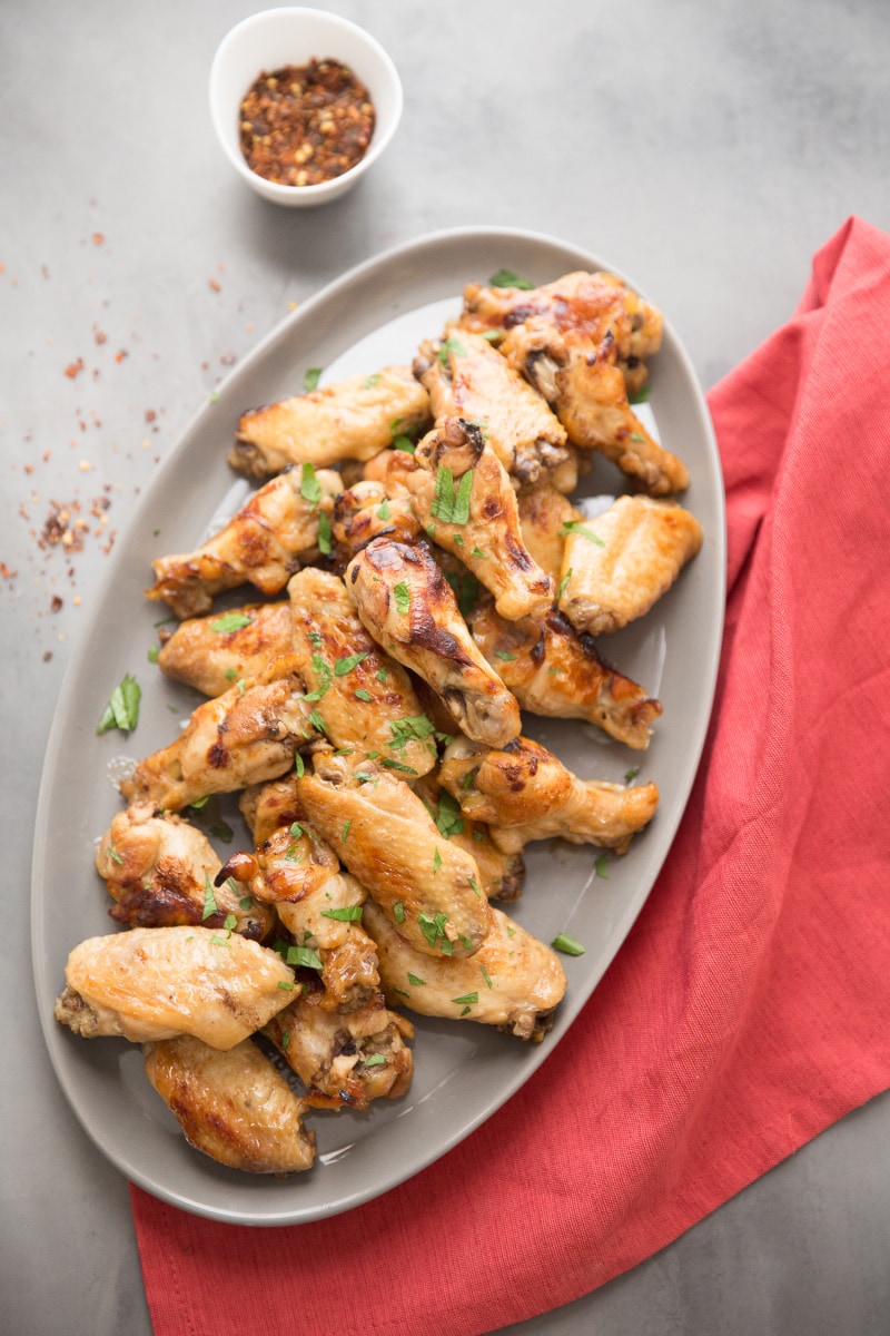Polynesian Chicken Wings recipe from RecipeGirl.com #polynesian #chicken #wings #recipe #RecipeGirl polynesian chicken wings on a platter