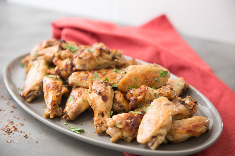 Polynesian Chicken Wings recipe from RecipeGirl.com #polynesian #chicken #wings #recipe #RecipeGirl polynesian chicken wings on a platter