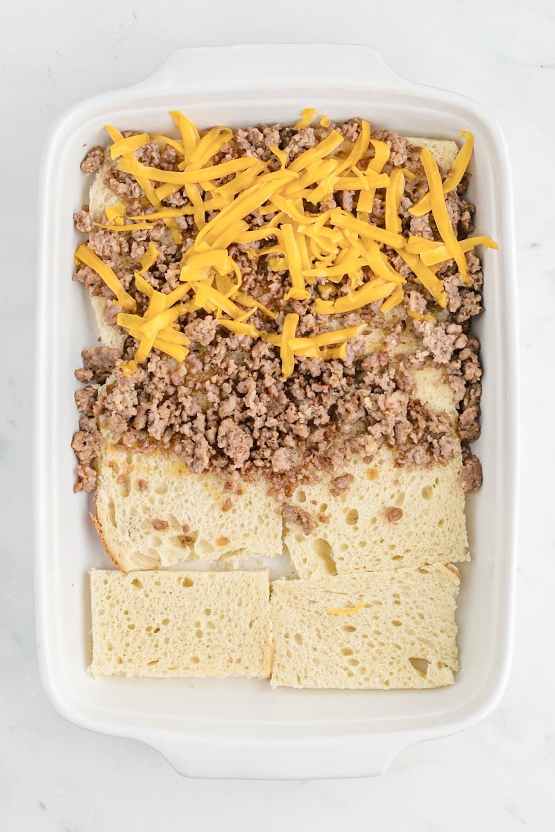 picture showing partial assembly of breakfast casserole in casserole dish