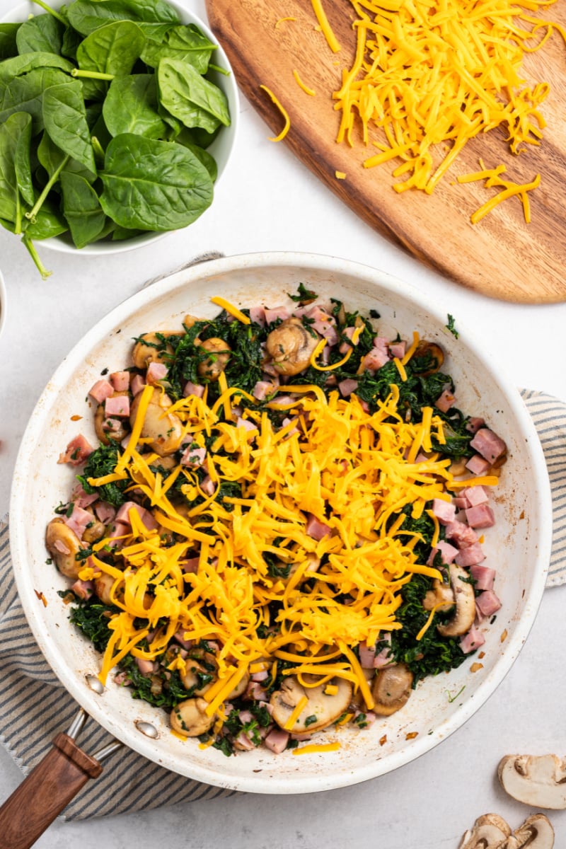 ingredients in bowl for filling of ham and spinach puff pancake