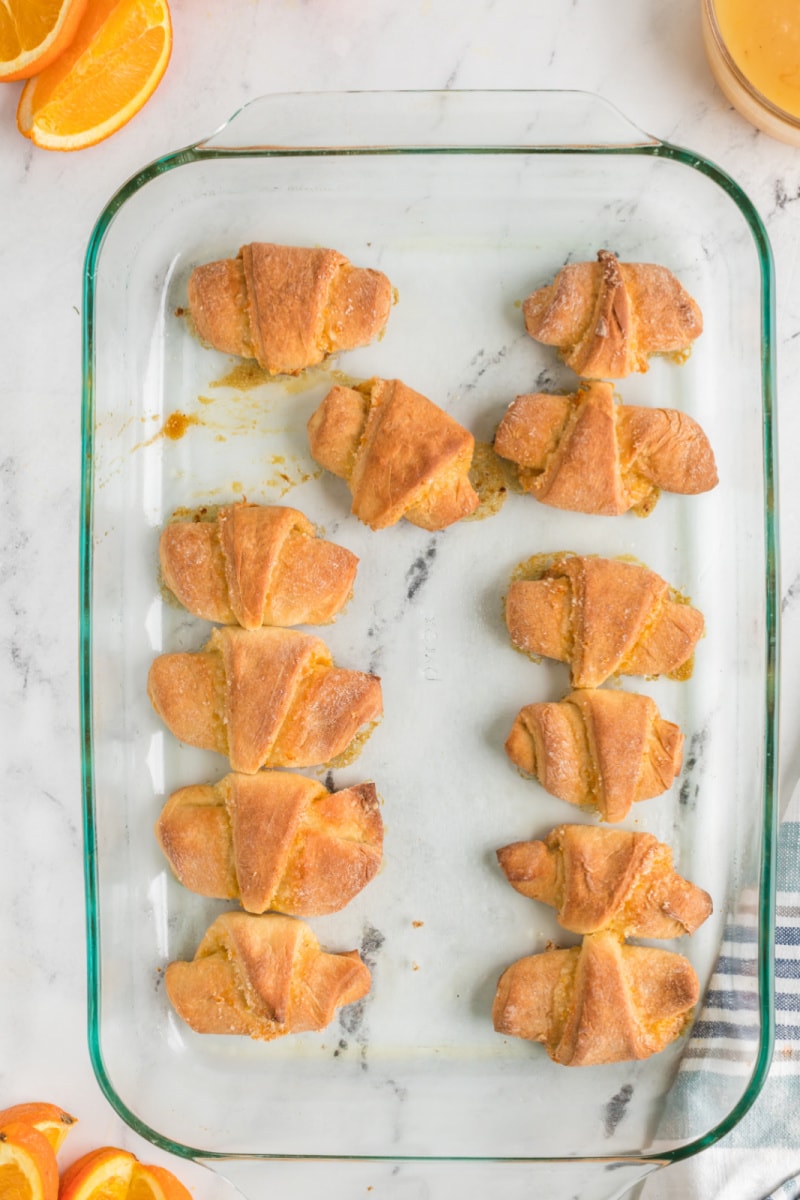 orange sticky buns baked in a pan