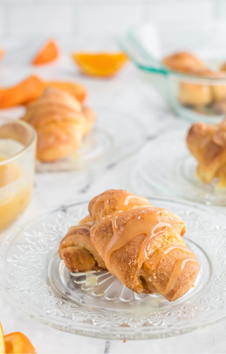 orange sticky buns on plates