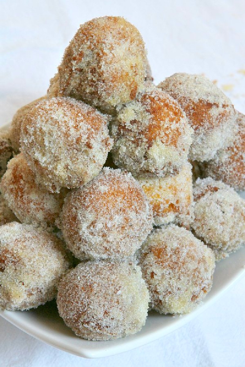 pumpkin doughnut drops stacked on platter