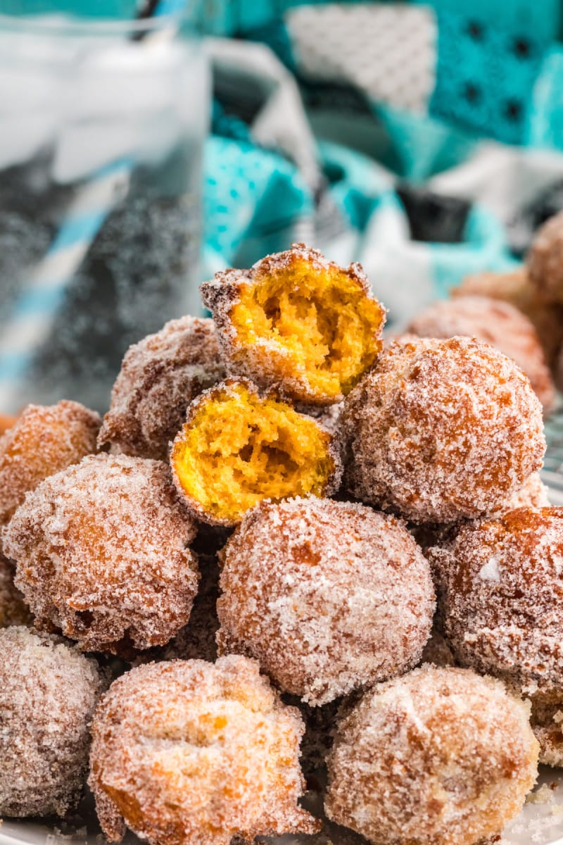 pumpkin doughnut drops stacked with one cut open