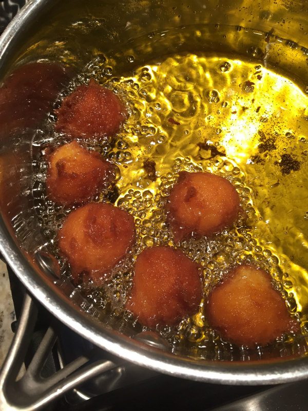 Pumpkin Doughnut Drops frying in oil