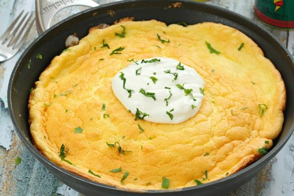 sour cream and ham omelette in a skillet