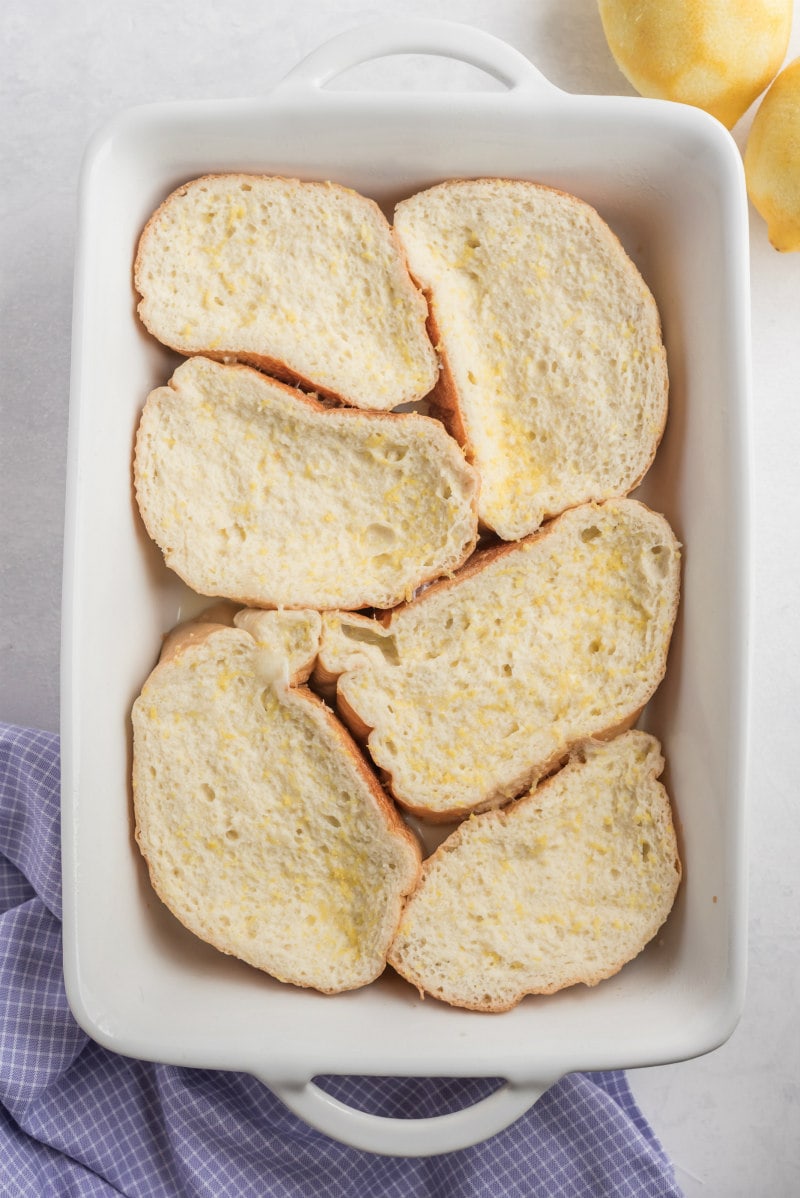 french bread dipped in egg custard and placed in white baking dish