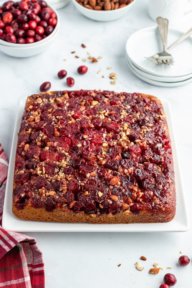 pumpkin cranberry upside down cake on white platter