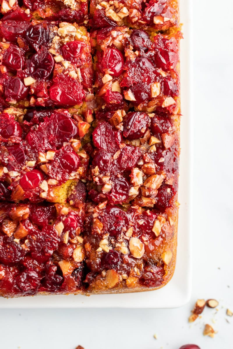 cranberry upside down cake cut into pieces