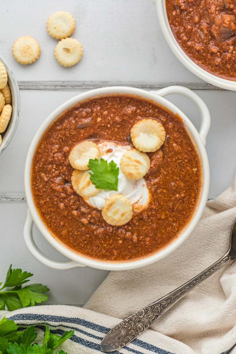 bowl of back bay chili with sour cream and crackers