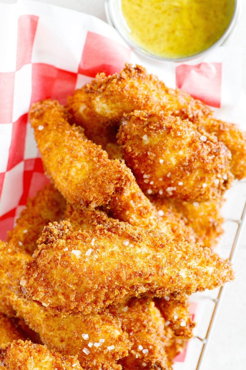 Easy Homemade Crispy Chicken Fingers with Honey Mustard Dipping Sauce recipe from RecipeGirl.com Crispy Chicken Fingers in a basket