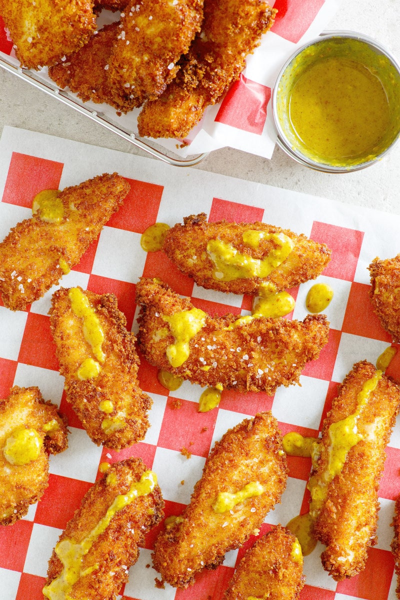 Easy Homemade Crispy Chicken Fingers with Honey Mustard Dipping Sauce recipe from RecipeGirl.com Crispy Chicken Fingers with Honey Mustard Dipping Sauce in a basket