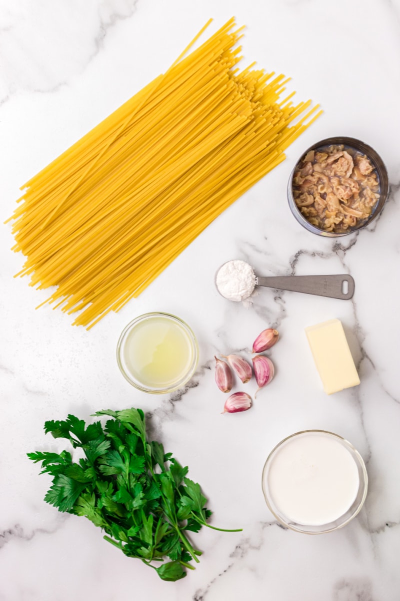 ingredients displayed for making clam linguine