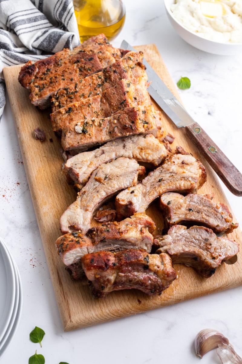 garlic and oregano pork ribs on a cutting board