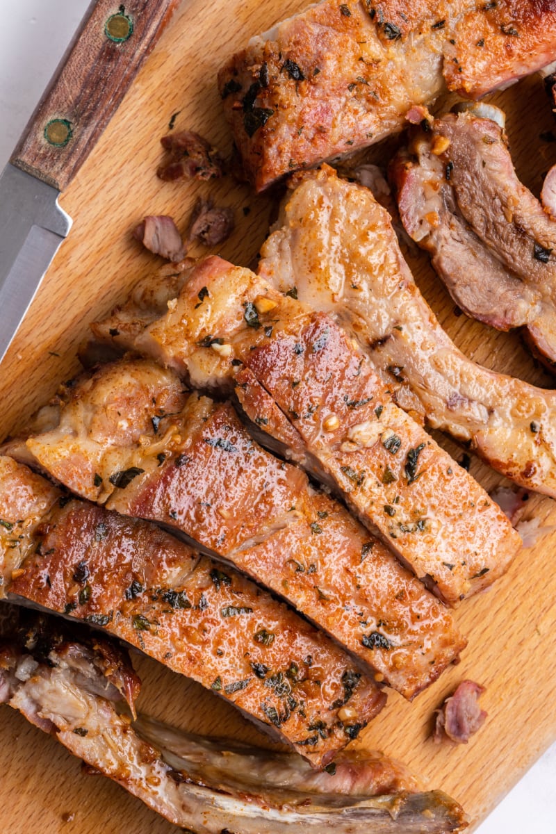 garlic and oregano pork ribs on a cutting board