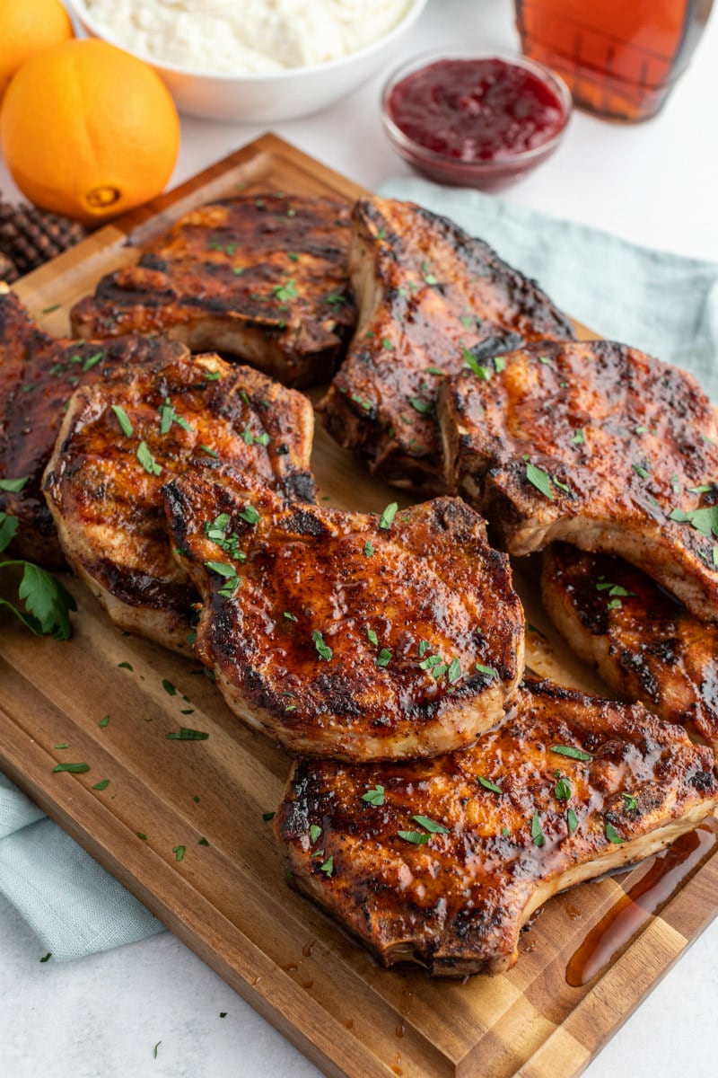 grilled pork chops on cutting board