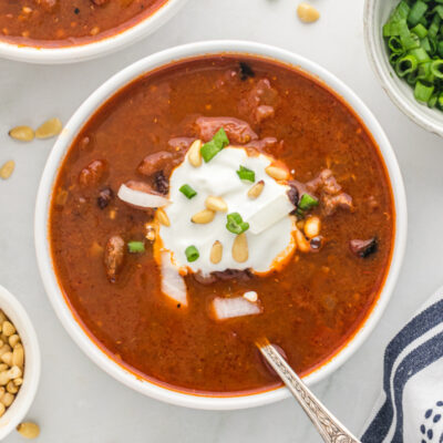 bowl of chili topped with sour cream